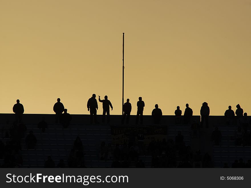 Soccer Fans Silhouettes In Sunset