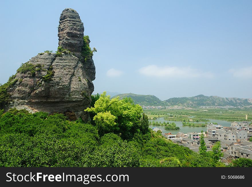 Volcanic sedimentary rock and village in the Linhai Geological Park,Zhejiang Province of China.