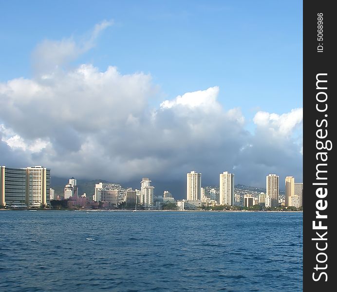 Bright Towers of Honolulu Skyline Viewed From Ocean, Hawaii. Bright Towers of Honolulu Skyline Viewed From Ocean, Hawaii