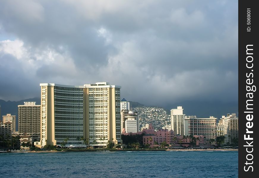 Bright Towers of Honolulu Skyline Viewed From Ocean, Hawaii. Bright Towers of Honolulu Skyline Viewed From Ocean, Hawaii