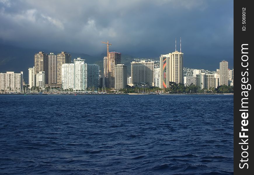 Bright Towers of Honolulu Skyline Viewed From Ocean, Hawaii. Bright Towers of Honolulu Skyline Viewed From Ocean, Hawaii