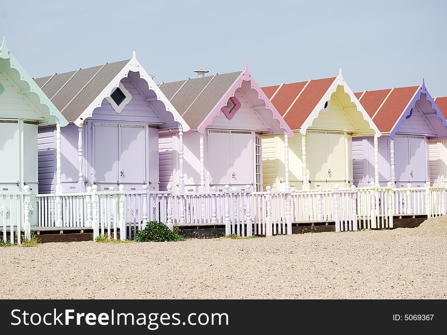 Shot of some pretty pastel beach huts on the beach. Shot of some pretty pastel beach huts on the beach