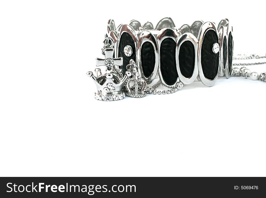 Silver bracelet and crowns isolated on the white.