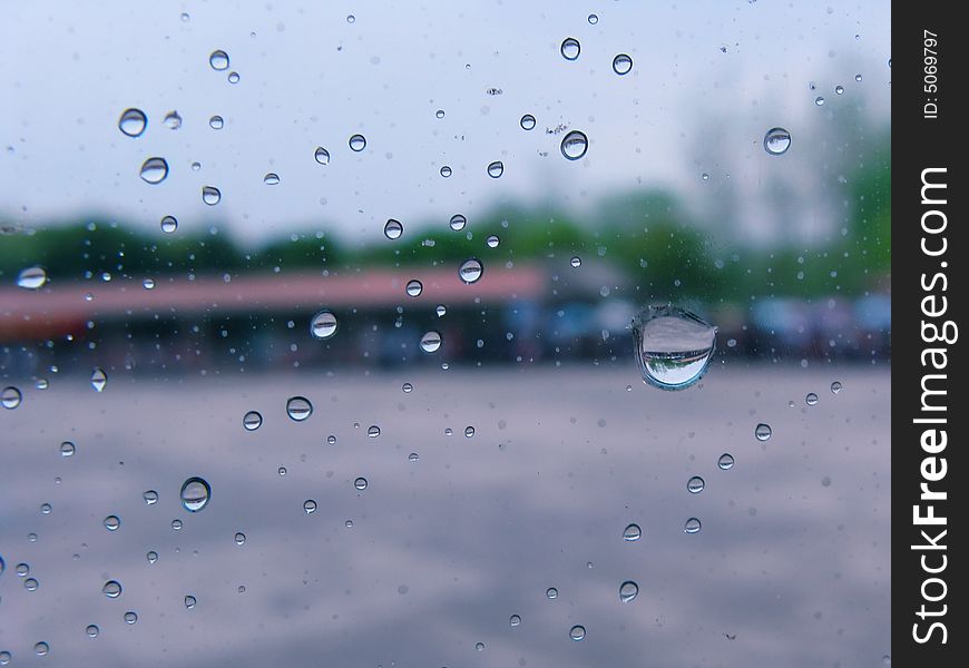 Macro shoot of rain drops on glass window