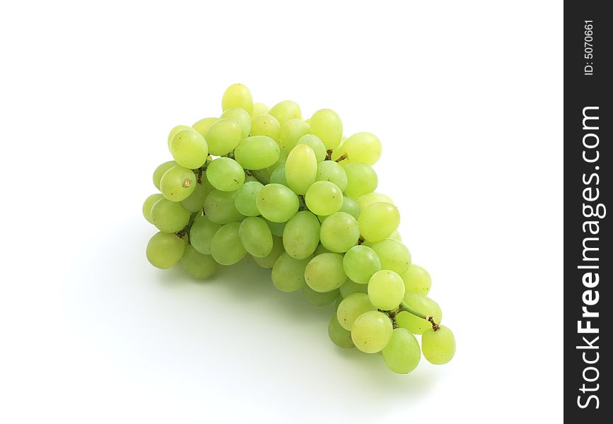 The branch of green grape isolated on the white background