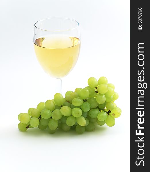 The branch of green grape isolated on the white background. The branch of green grape isolated on the white background