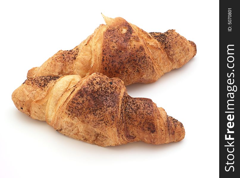 Croissants with cinnamon isolated on white background