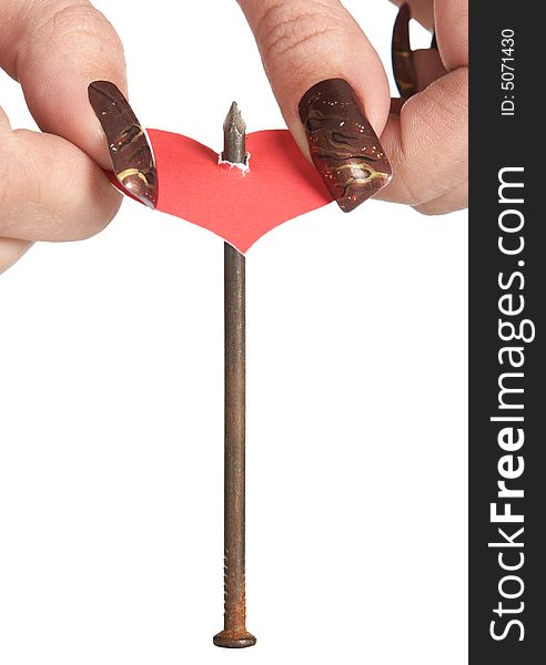 Sticking red heart on iron nail