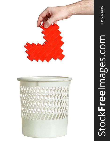 Throwing heart in refuse bin isolated over white background
