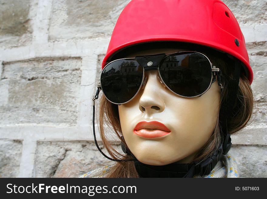 A mannequin of mountaineer with her red helmet