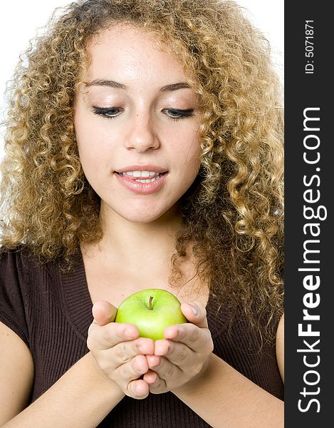 A beautiful young women holding an apple