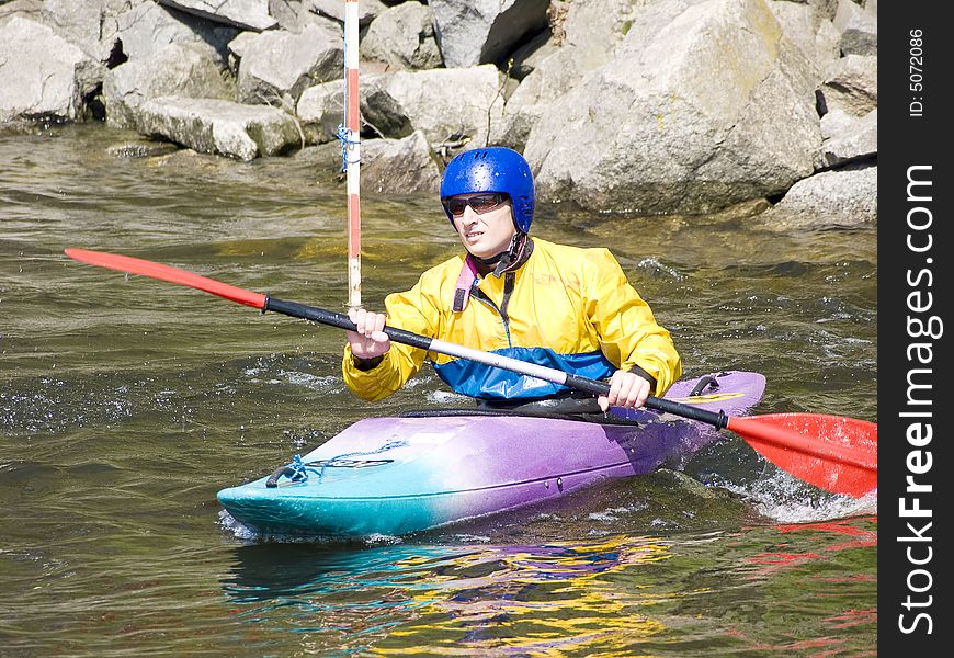 Image of the kayaker with an oar on the water