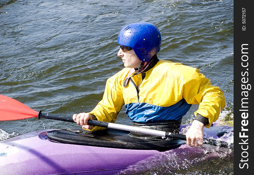 Image of the kayaker with an oar on the water