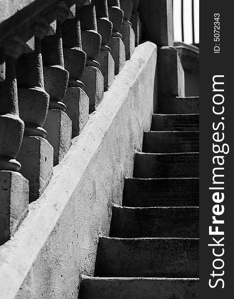 Concrete stairs and railing in black & white.