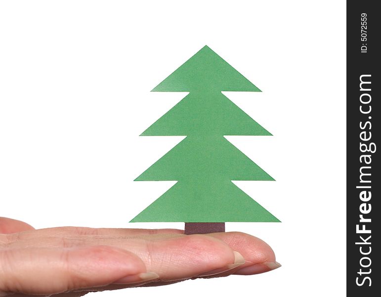 Fingers holding Christmas tree isolated over white