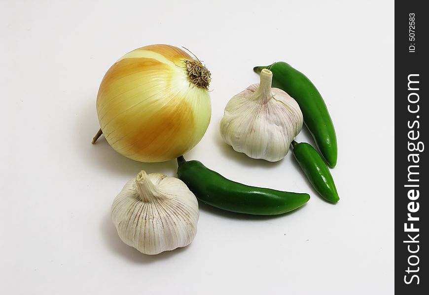 Garlic, onion, green pepper isolated on white. Garlic, onion, green pepper isolated on white