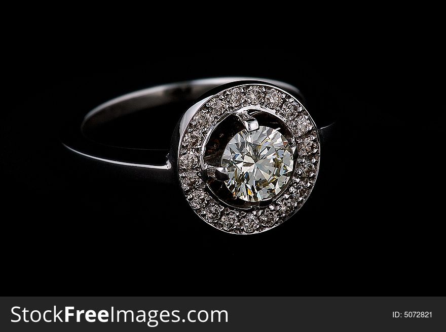 Ring with diamonds on black background