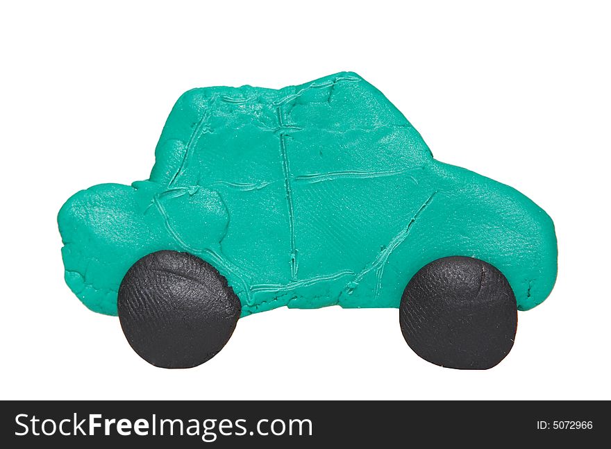 Small modeling clay car over white