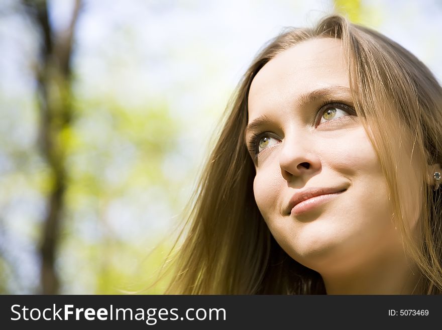 Young Woman Smiling Under The Sunlight. Young Woman Smiling Under The Sunlight