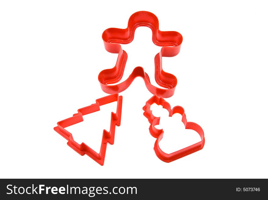 Three red Christmas Cookie Cuttters On A White Background. Three red Christmas Cookie Cuttters On A White Background.