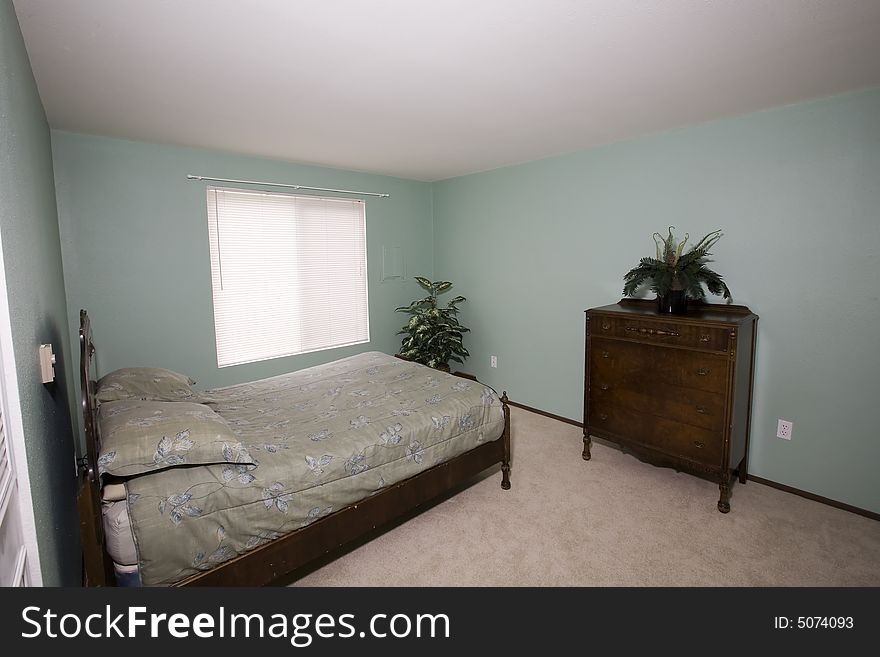 View of an ordinary bedroom in a condominium. View of an ordinary bedroom in a condominium