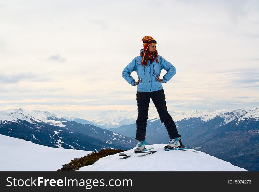 Skier at the peak of the mountain. Alps