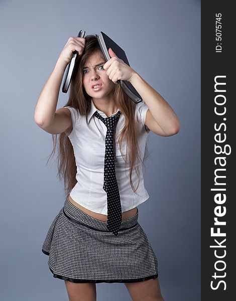 Emotional studet girl with long hair and black-and-white miniskirt. Emotional studet girl with long hair and black-and-white miniskirt