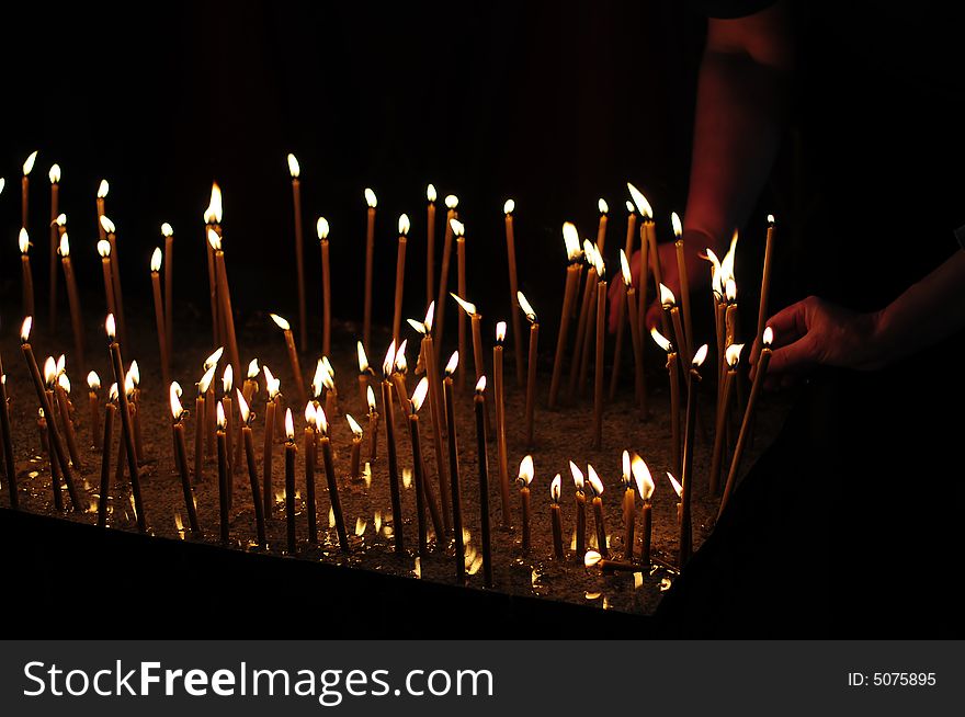 A view with candles into a church