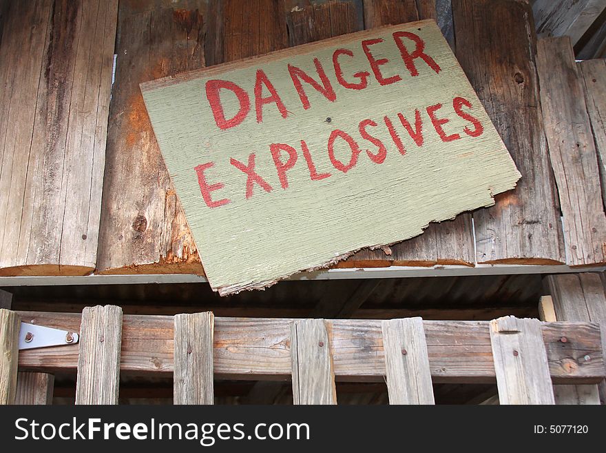 A sign used as a Western movie prop warns of the danger of explosives. A sign used as a Western movie prop warns of the danger of explosives.
