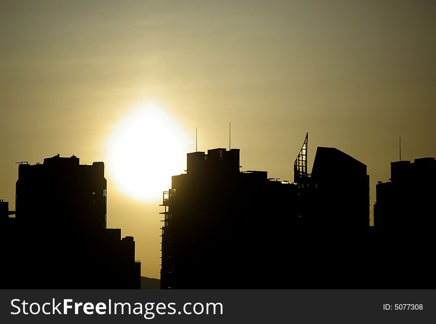 A modern city skyline at the sunrise. A modern city skyline at the sunrise