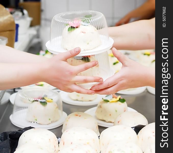 Women made and sell sweet cakes with flowers