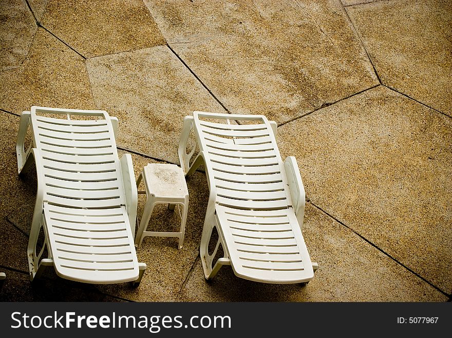 Empty white pool chairs waiting for tourists. Empty white pool chairs waiting for tourists