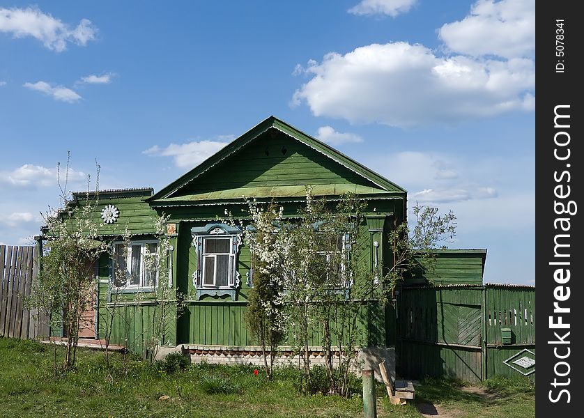 The rural wooden house in the summer