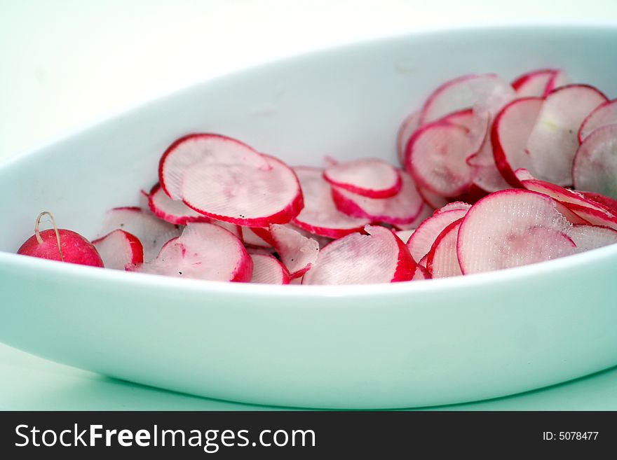 A salad of red radish in beautiful table-ware