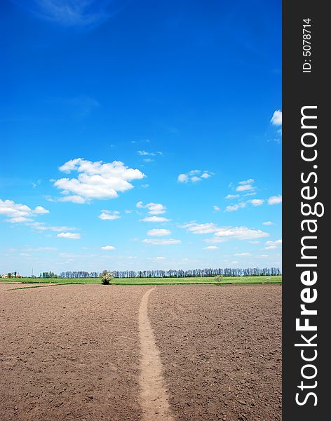 Beautiful country blue sky and black ground