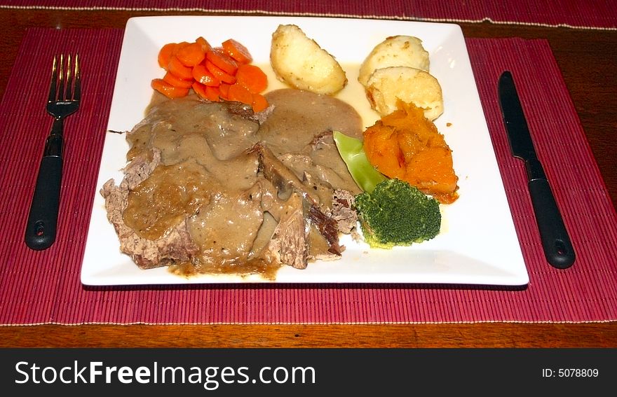 Home cooked roast beef meal with roast vegetables. Home cooked roast beef meal with roast vegetables