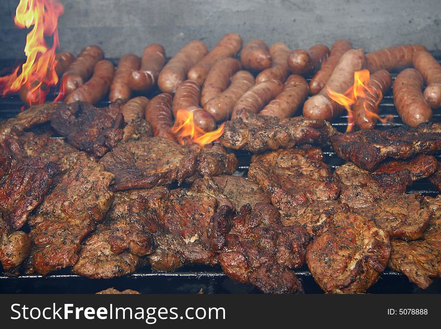 Close up of grilled meat and sausage, outdoor. Close up of grilled meat and sausage, outdoor