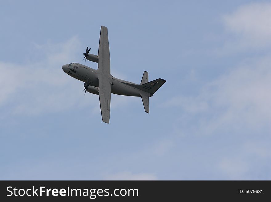 Jet airplane in the clouds and sun