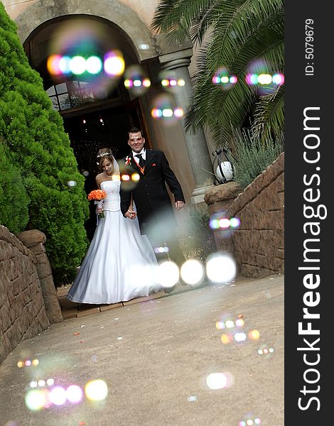 A wedding couple and bubble confetti. A wedding couple and bubble confetti