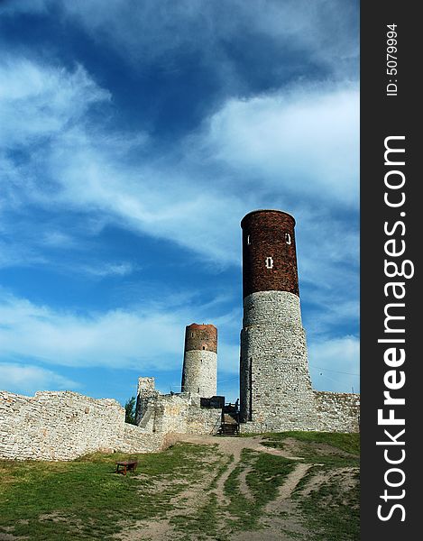 Historical castle in mountains with blue sky