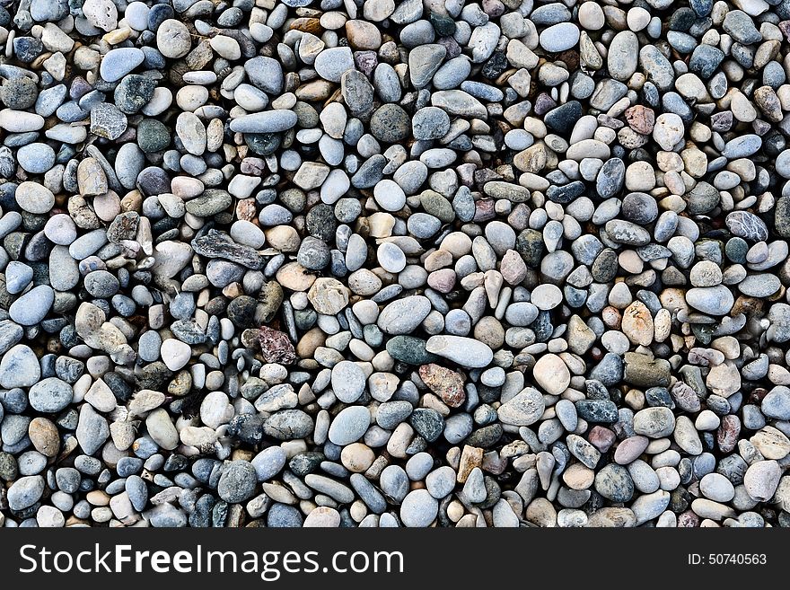 Pebble stones on the ground background texture. Pebble stones on the ground background texture