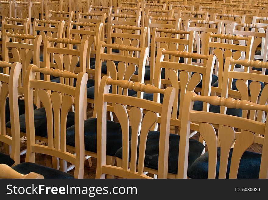 Wooden chairs in conference hall