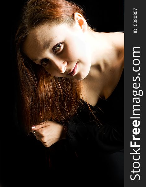 Woman`s face against a black background