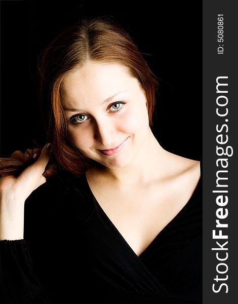 Woman with long hair against a black background