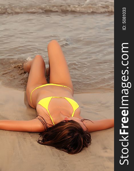 Woman Relaxing On The Beach