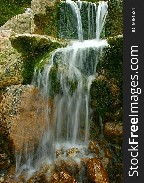 An image of a waterfall with the water flowing soft