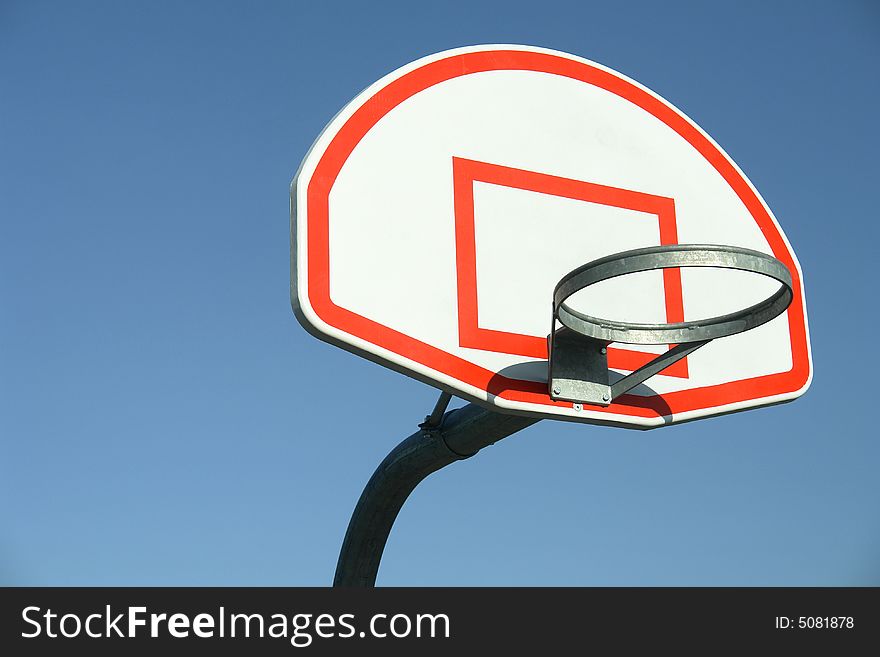 Isolated view of basketball rim and backboard. Isolated view of basketball rim and backboard