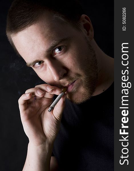 Man Smoking A Cigarette