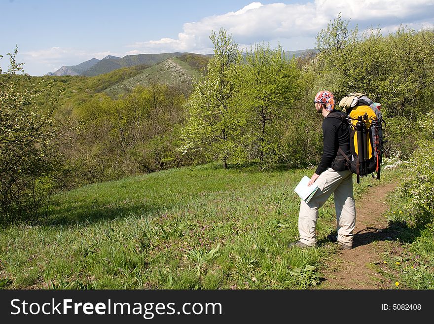 Active people - Person climbing a cliff. Active people - Person climbing a cliff