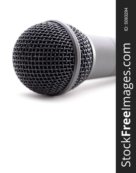 Closeup of a microphone on white